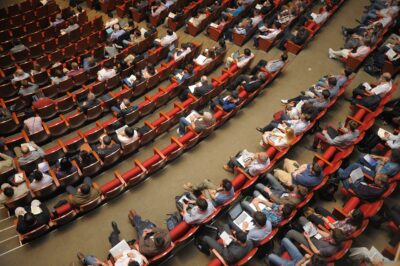 people seated in an auditorium